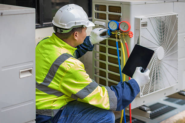 Professional Hvac technician working in Millville, MA